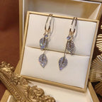 Ideales Geschenk - Ohrringe mit Muschelimitat und Zirkonia